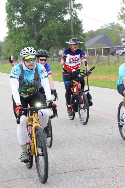 Bike riders participating in Bluebonnet Express cycling event, enjoying a scenic route with friends.