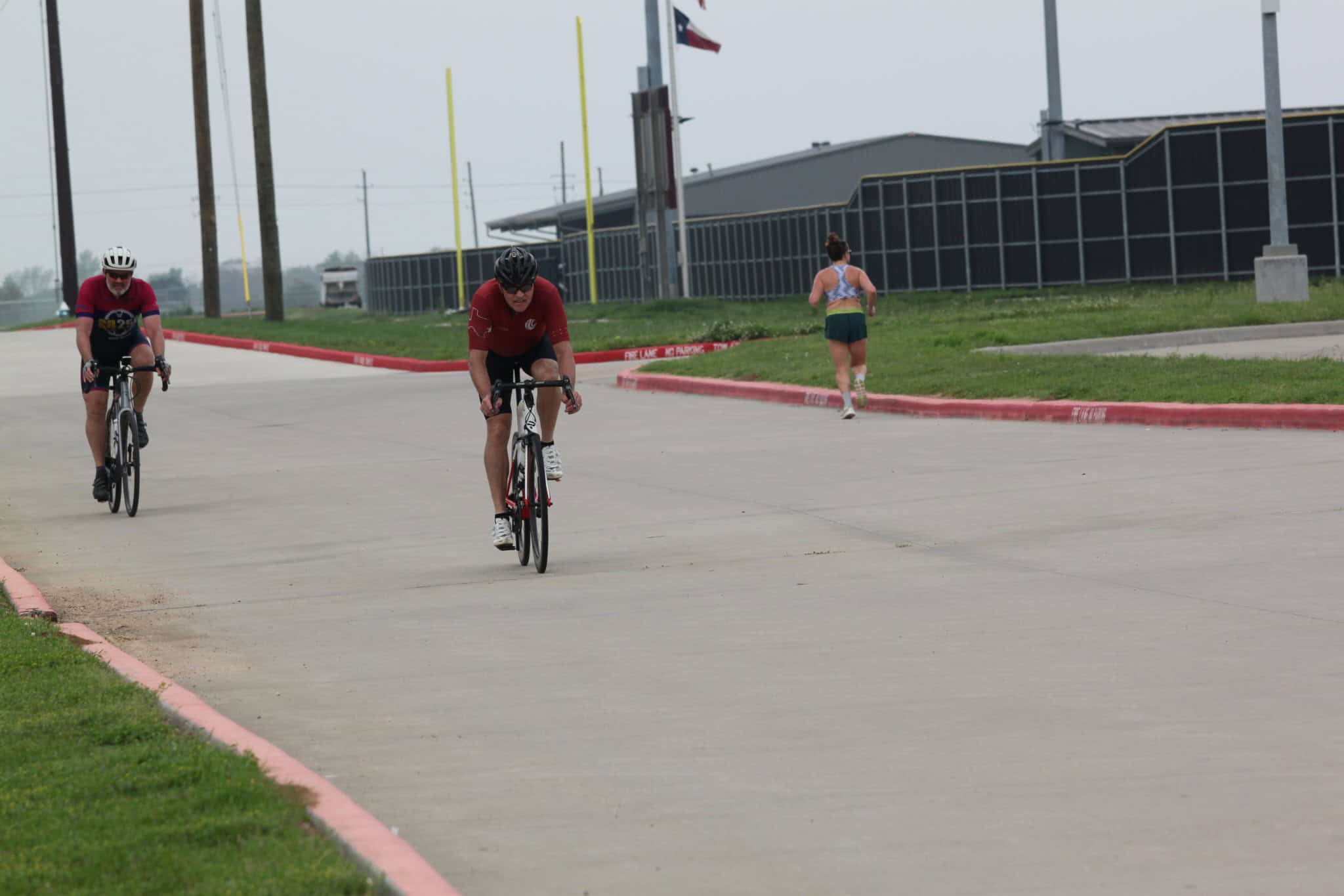 Riders on bikes enjoying Bluebonnet Express, a scenic Texas bike trail with varied terrain.