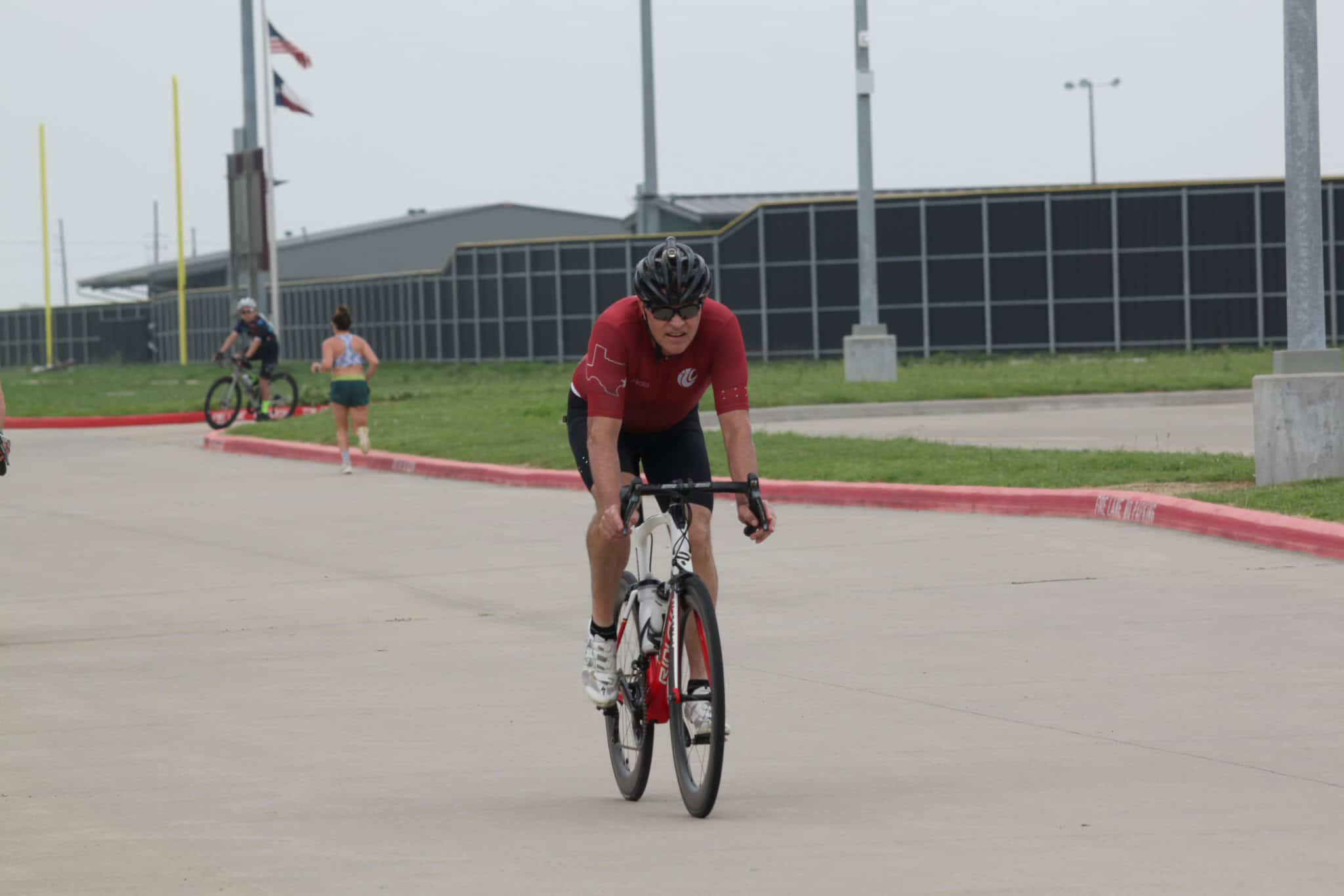 High-performance cyclist riding a bike outdoors during a race or training session.