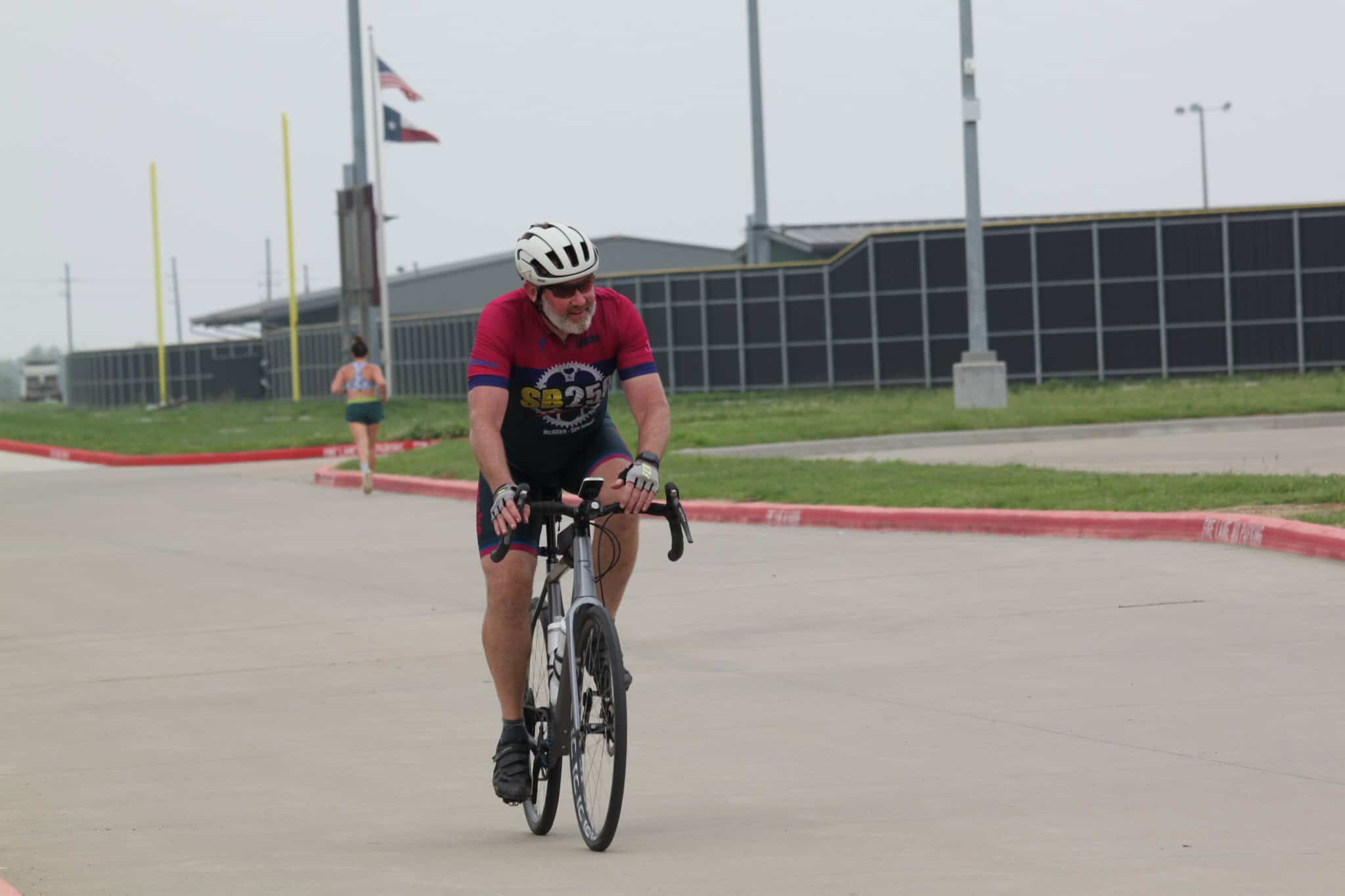 Bike rider in cycling gear on a racing bike during Bluebonnet Express event, Texas cycling race.