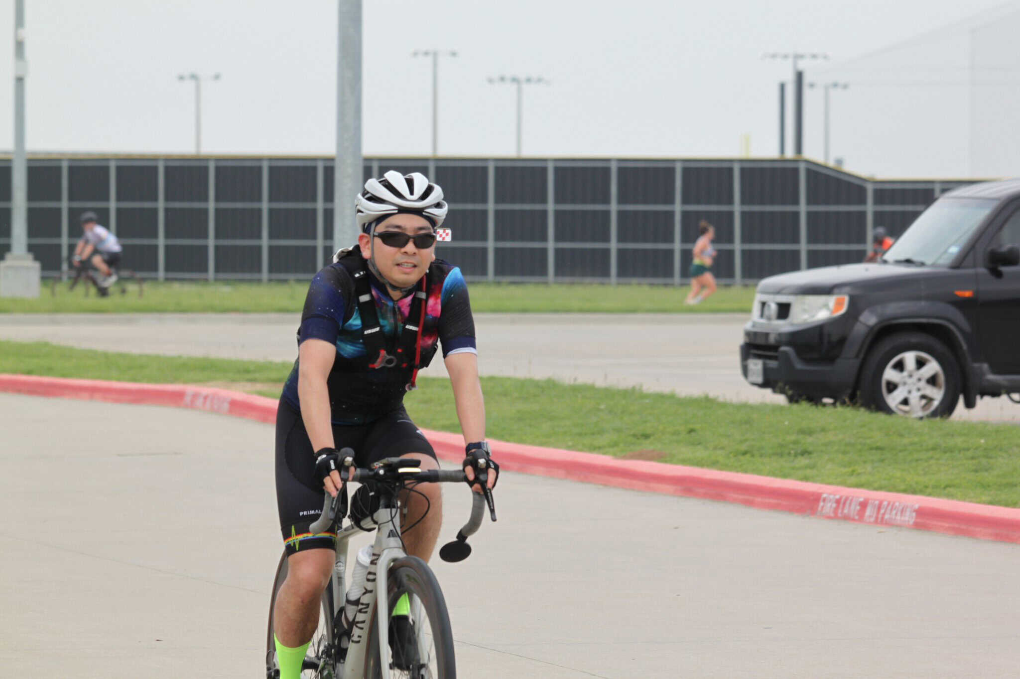 Smooth riding with Bluebonnet Express bike delivery service, eco-friendly cycling in city streets.