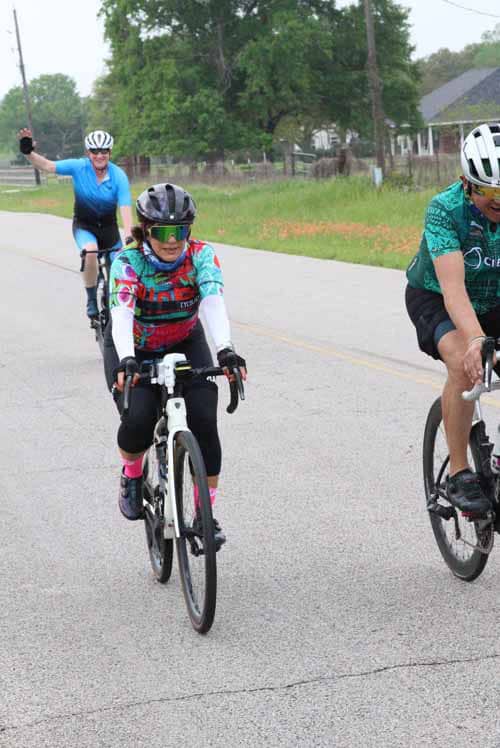Bike ride event at Bluebonnet Express with smiling cyclists enjoying a scenic ride.