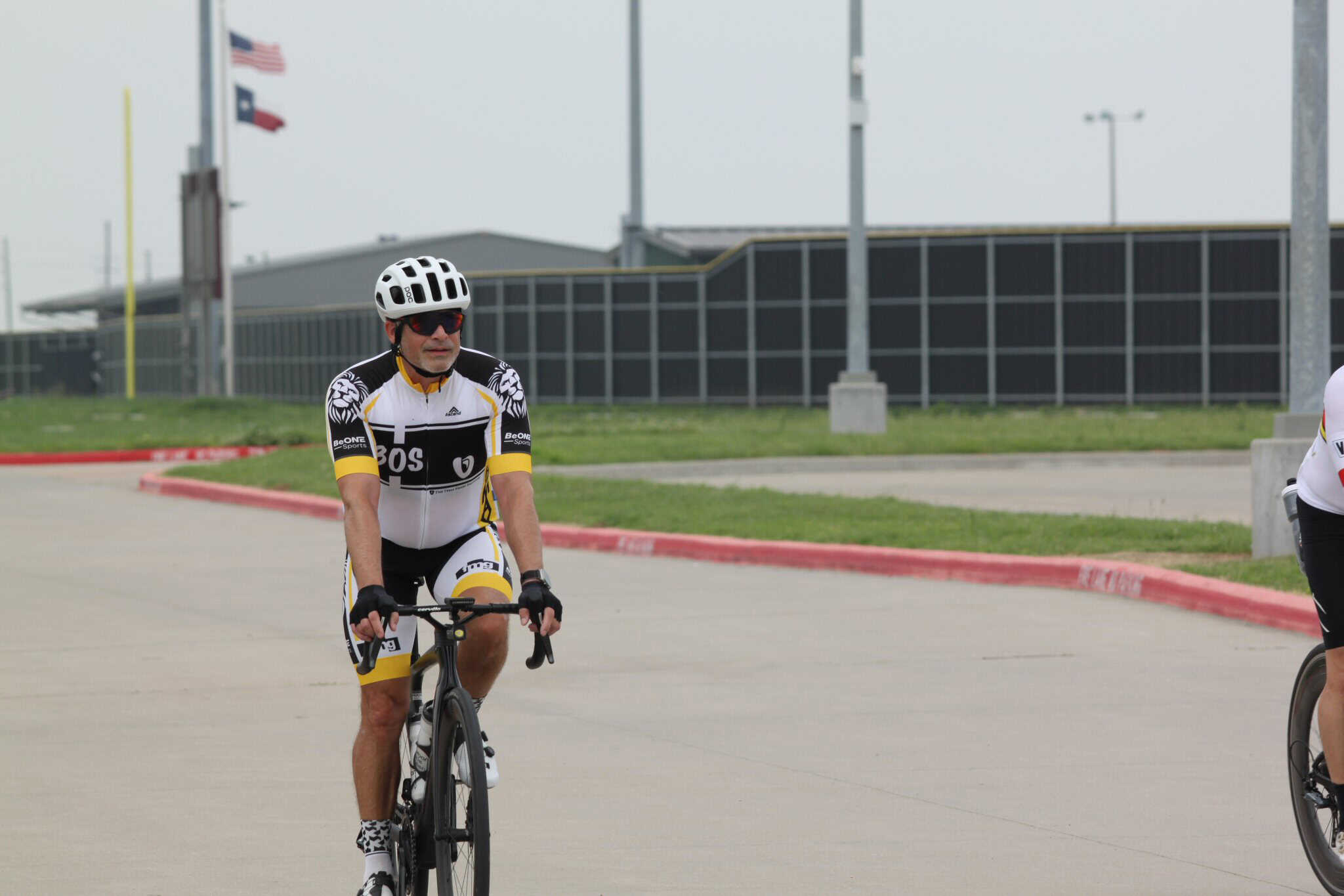 Cyclist riding on a road, promoting Bluebonnet Express bike service and cycling events.