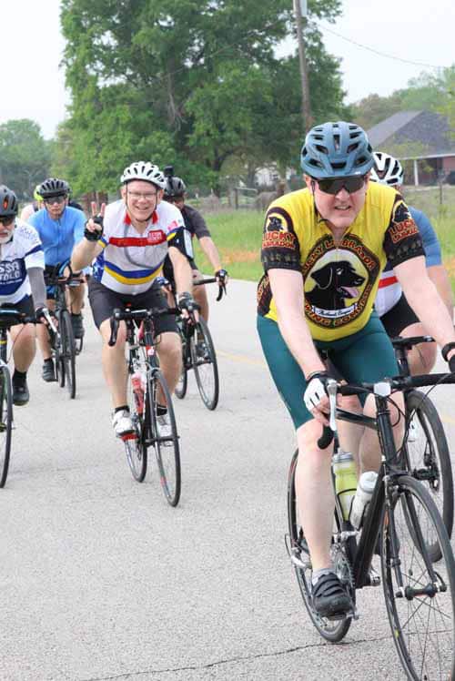 Riders participating in the Bluebonnet Express cycling event, enjoying a group ride outdoors.