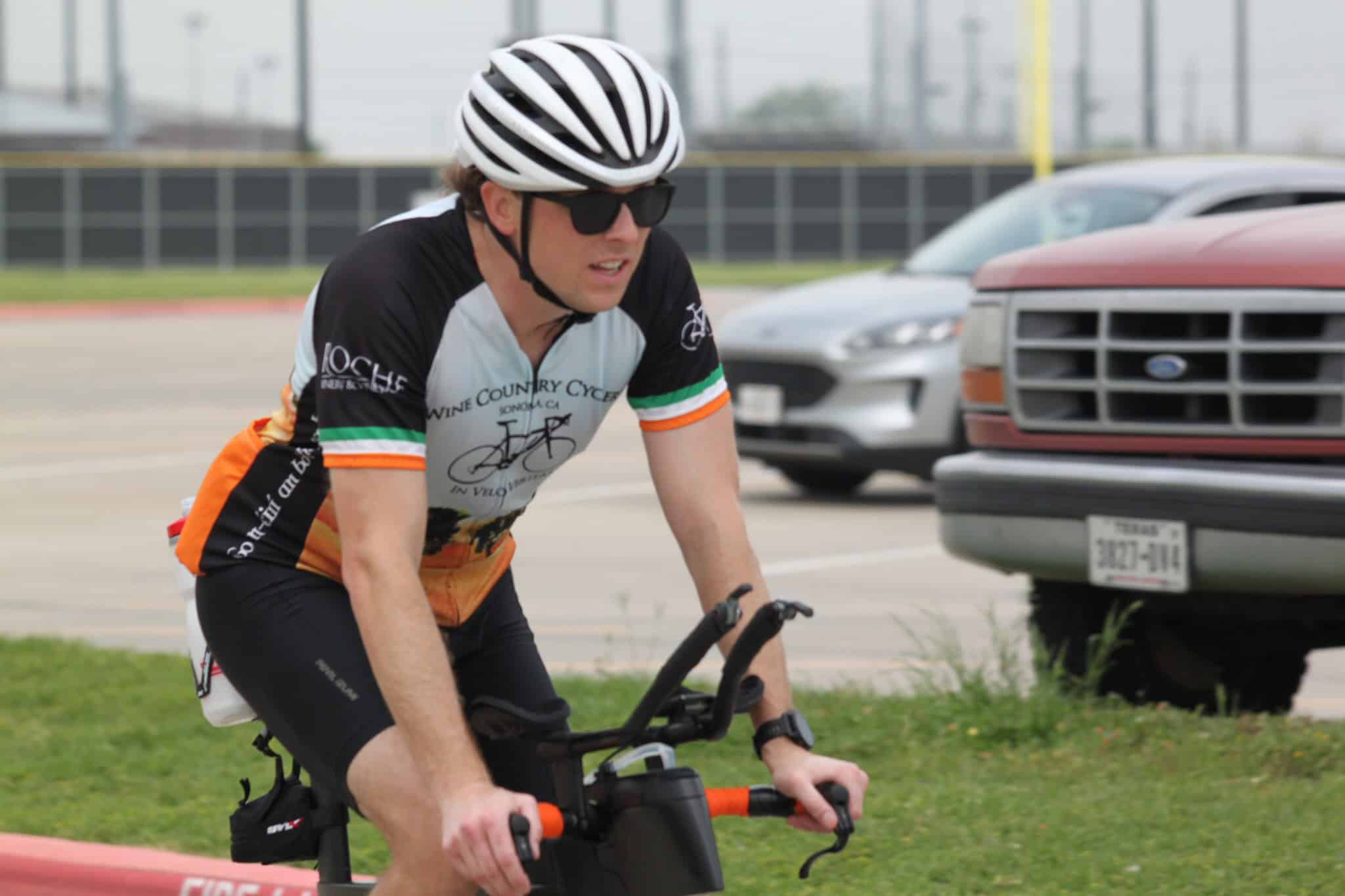 Cyclist riding an e-bike during Bluebonnet Express event in Texas, promoting cycling and eco-friendly transportation.