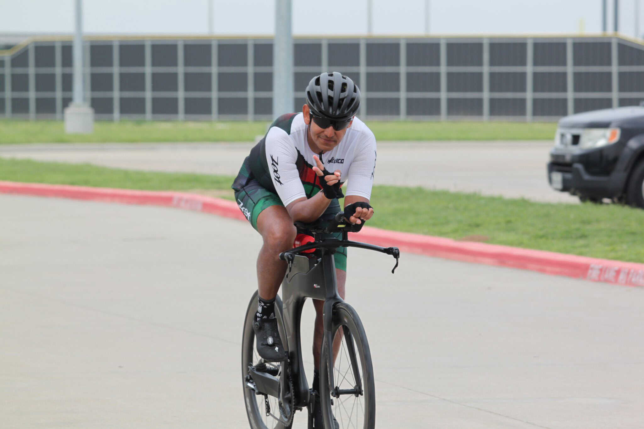 High-performance cyclist riding an e-bike during training session for Bluebonnet Express event.