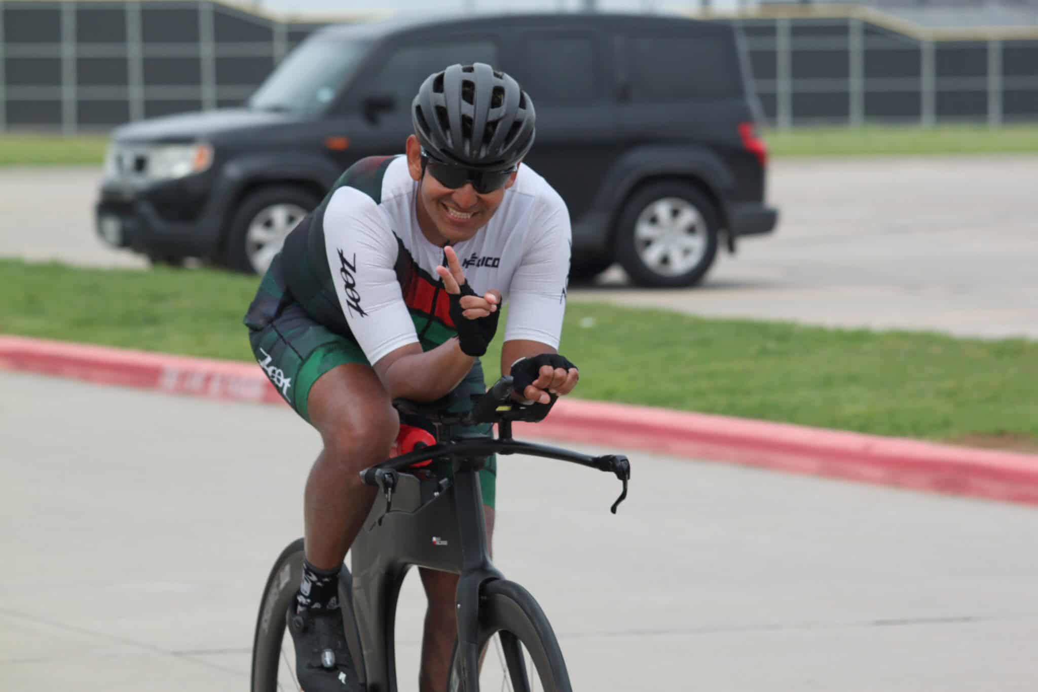 Man riding e-bike at Bluebonnet Express cycling event outdoors.