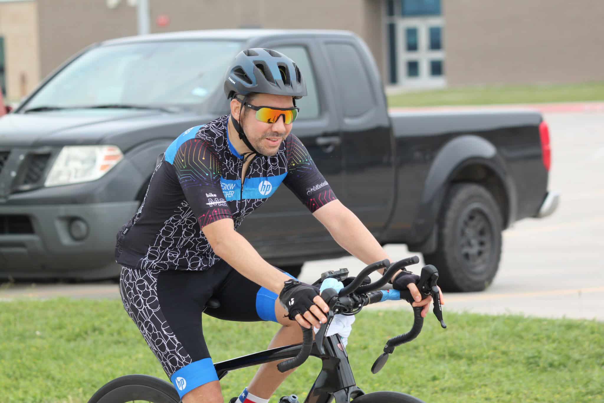 Cyclist riding a bike in Bluebonnet Express cycling event, showcasing performance and endurance.