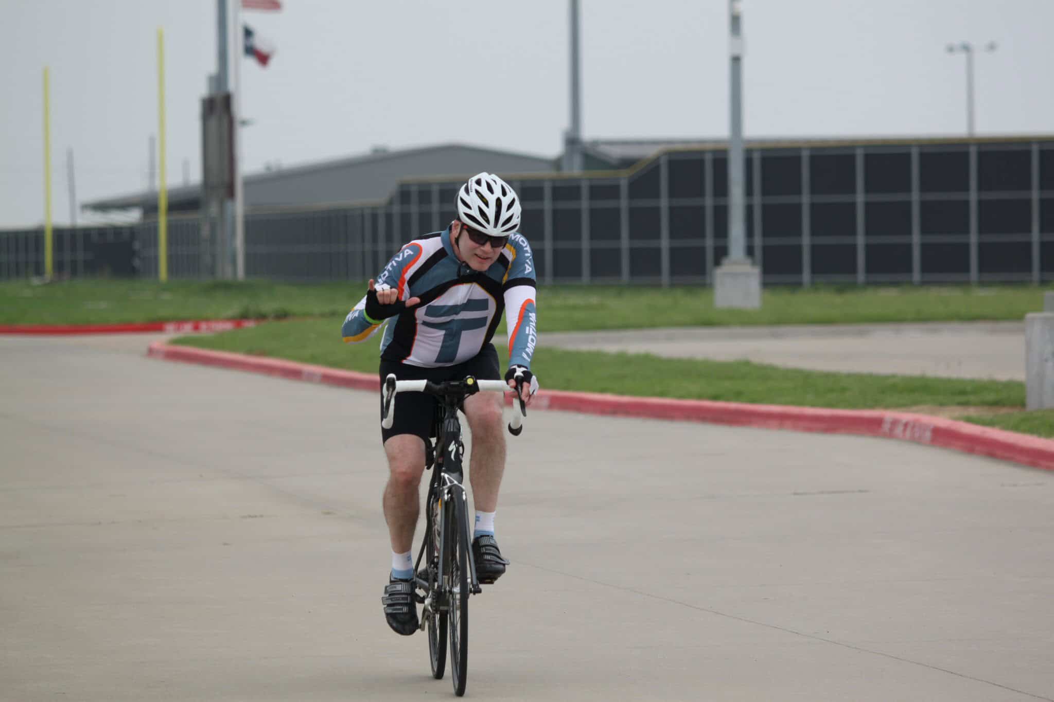 Bright male cyclist enjoying Bluebonnet Express cycling event on a clear day.