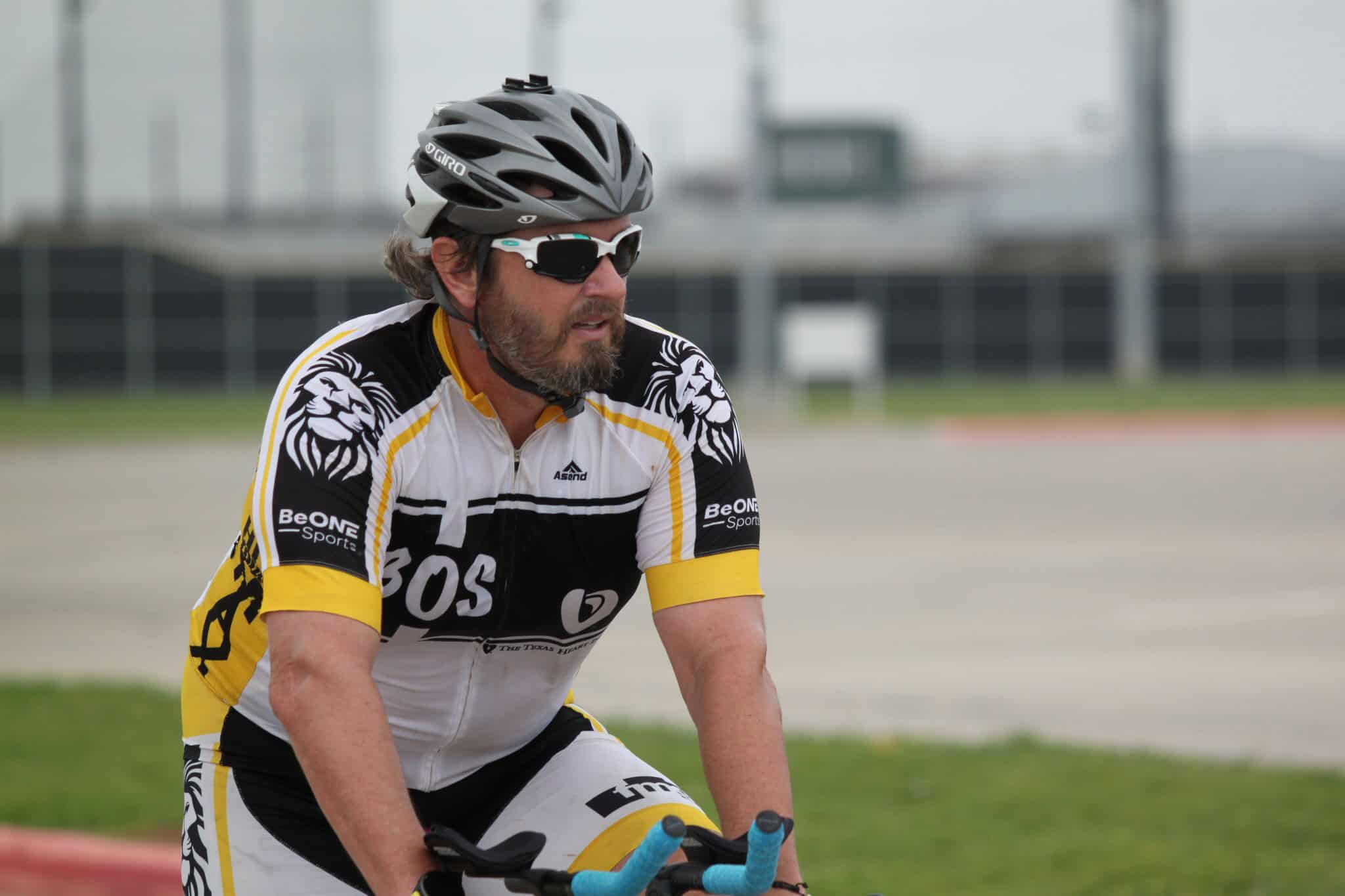 Cyclist with helmet and sunglasses riding at Bluebonnet Express athletic pace.