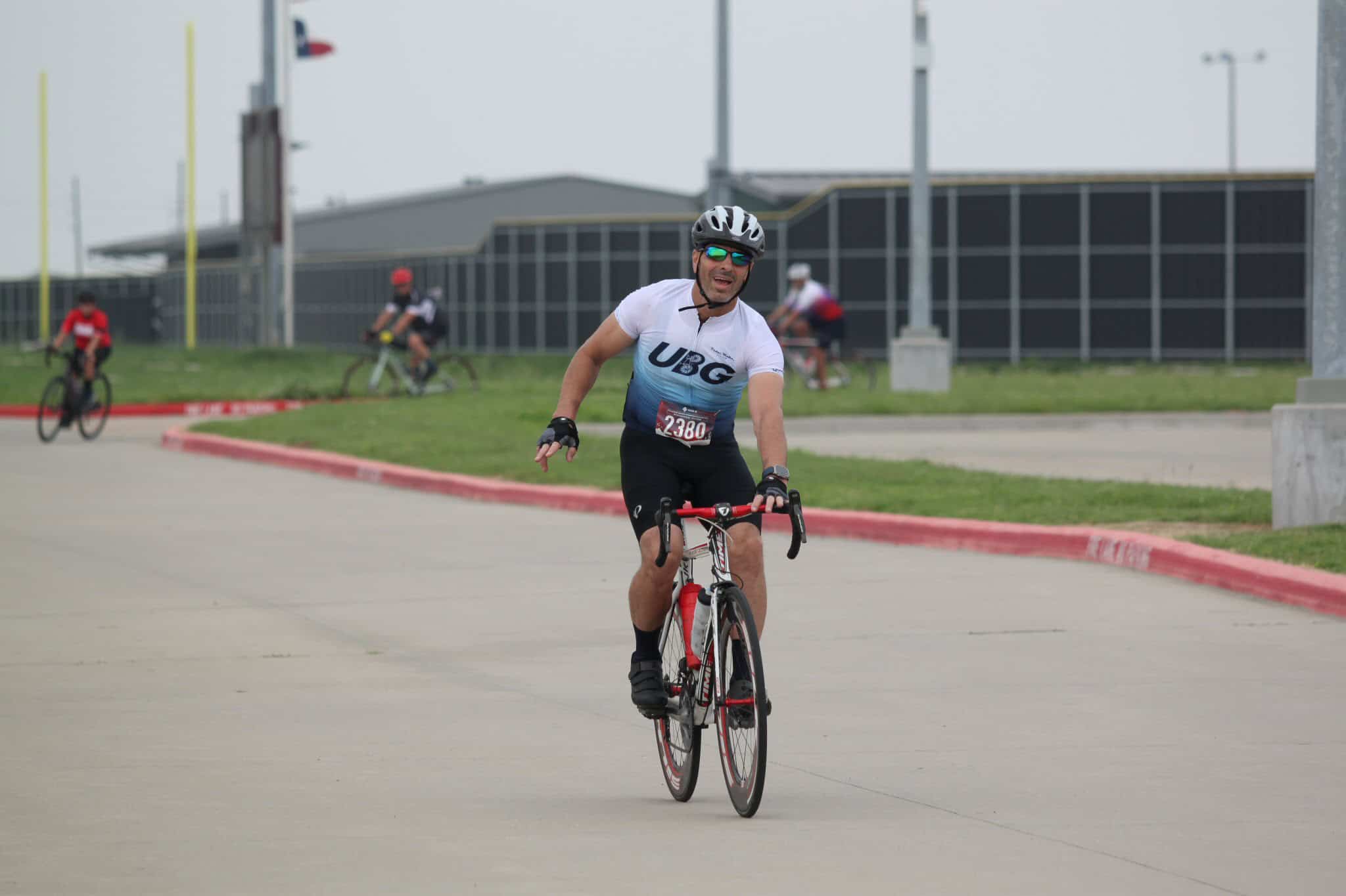 1. Man riding a road bike during Bluebonnet Express cycling event in Texas.