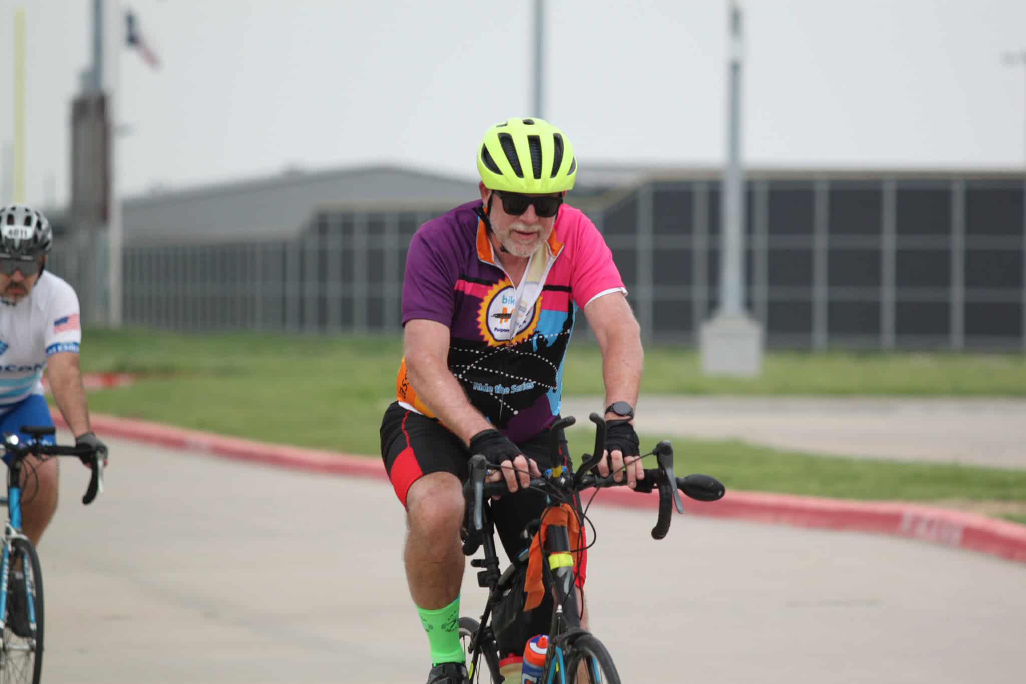 High-energy cyclist enjoying Bluebonnet Express bike ride event.