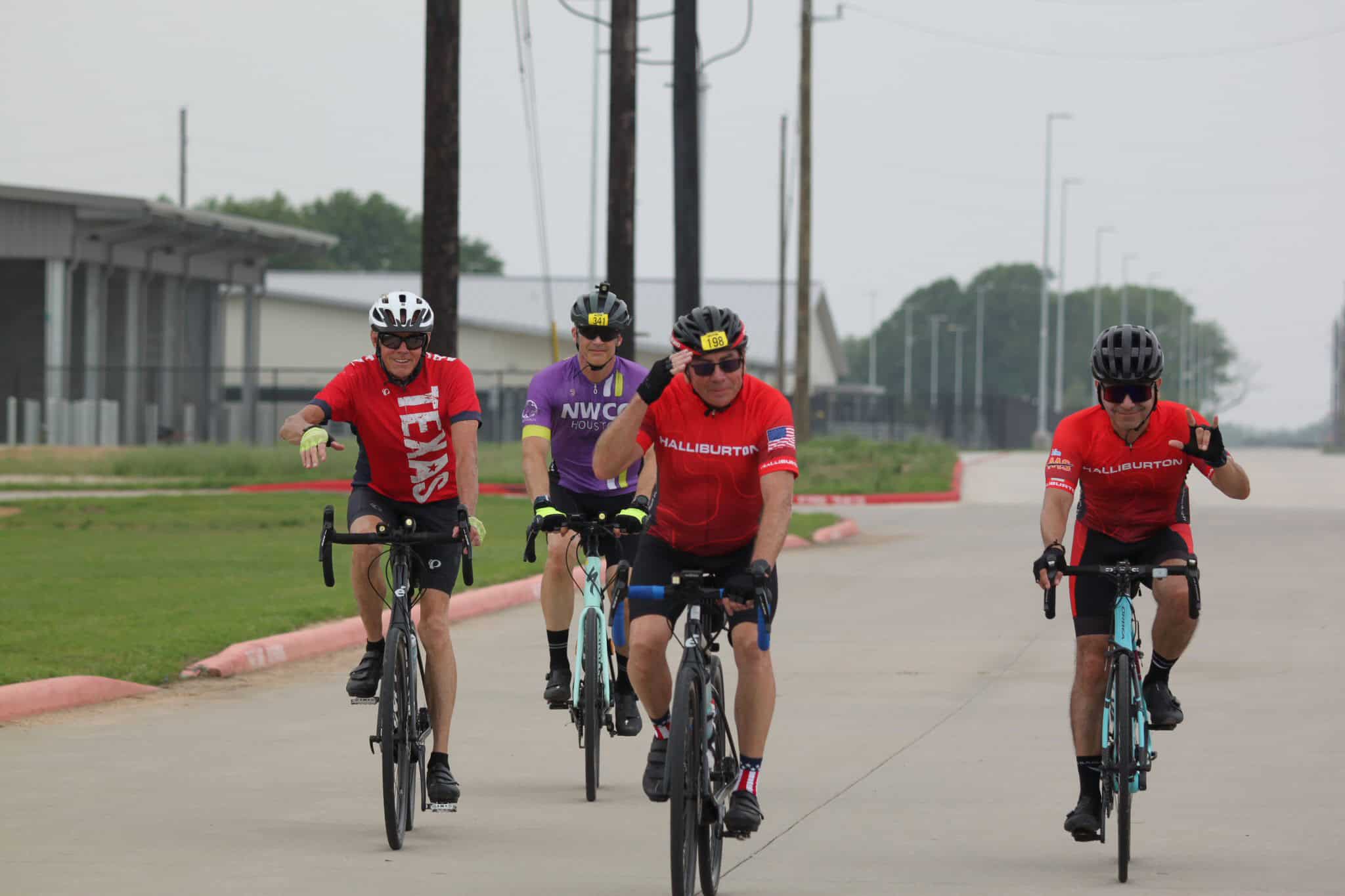 Cyclists riding together on a scenic bike route during the Bluebonnet Express event.