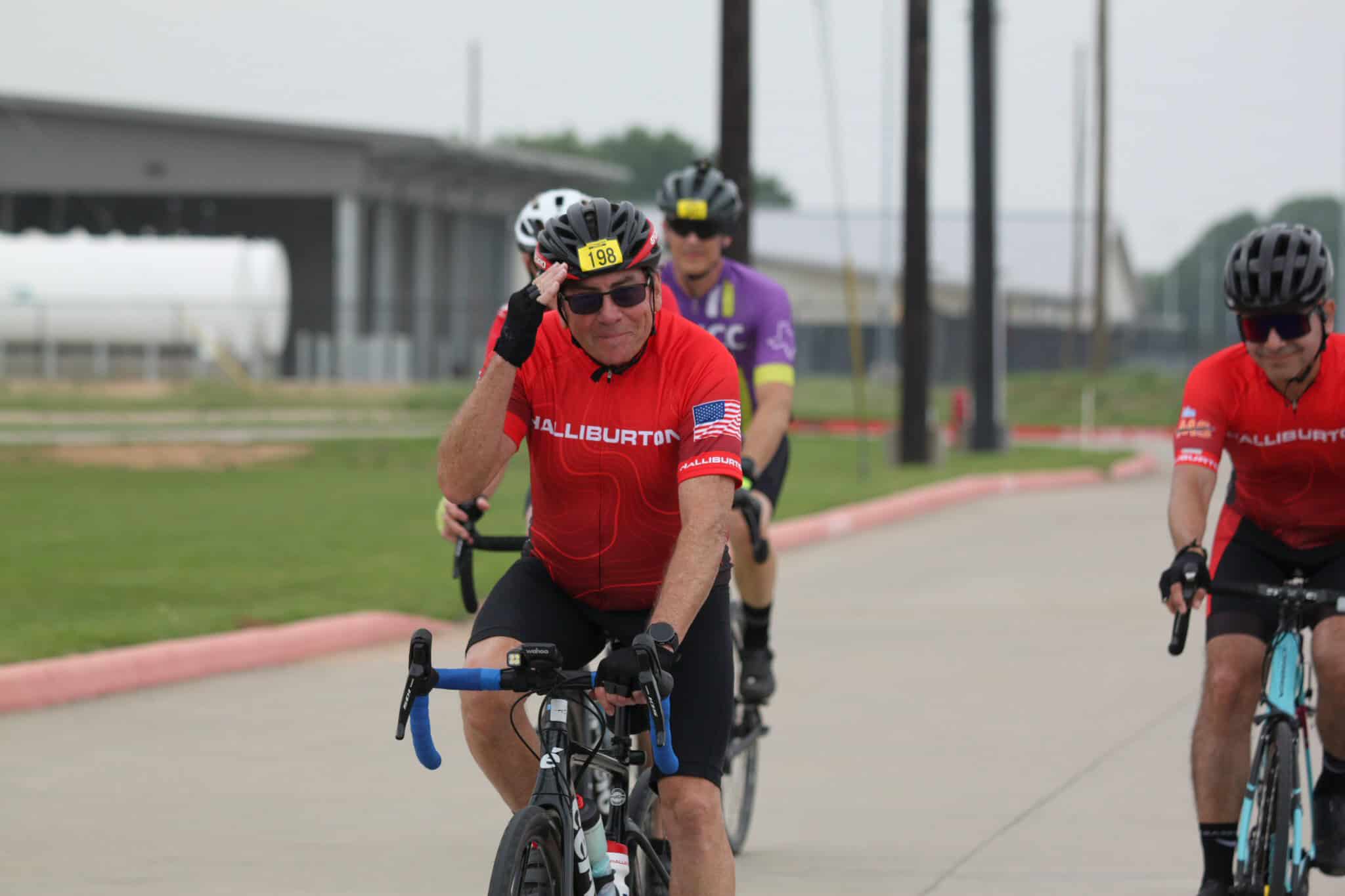 Cycling group participating in Bluebonnet Express cycling event, outdoor bicycle race, Texas bike tour.