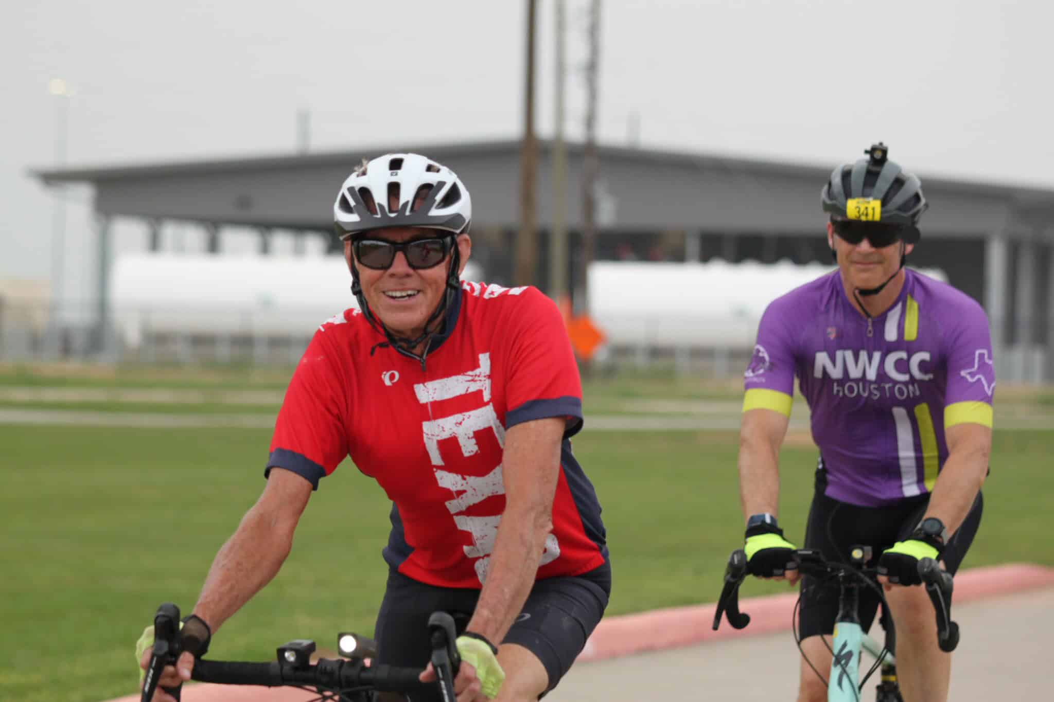 Brightly dressed cyclists enjoying a ride on Bluebonnet Express bike trail in Houston, Texas.