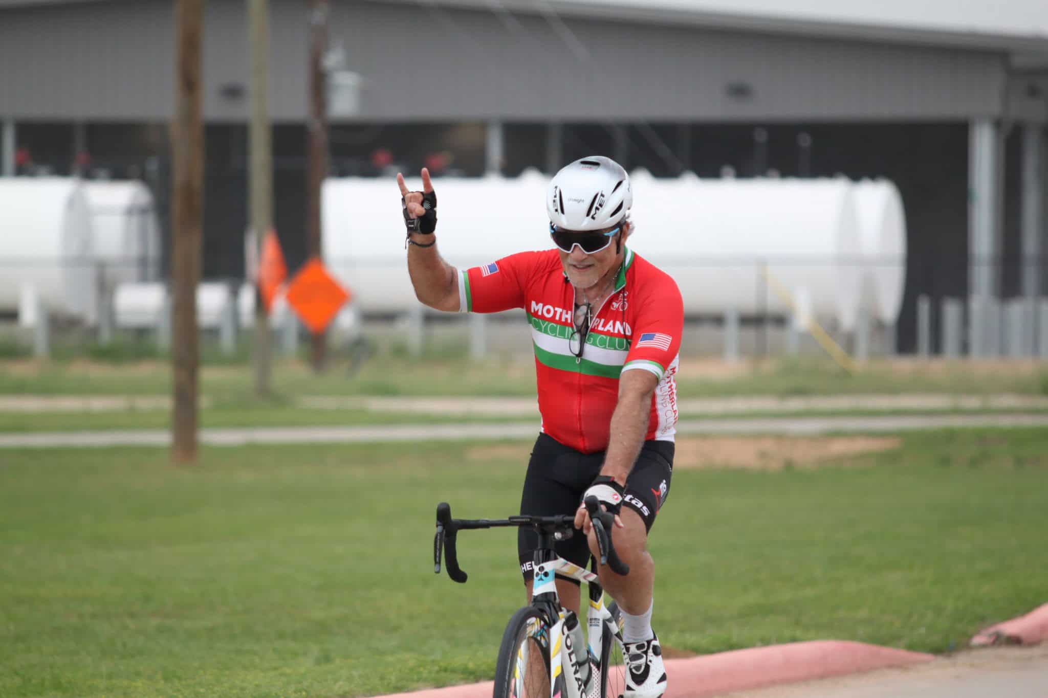 Victory cyclist celebrating during a ride at Bluebonnet Express event.