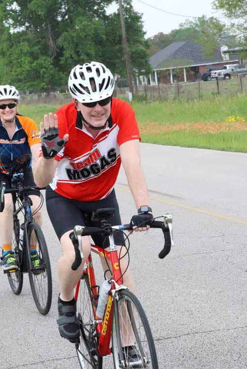 Active cyclist riding during Bluebonnet Express event in Texas, promoting cycling and outdoor fitness.