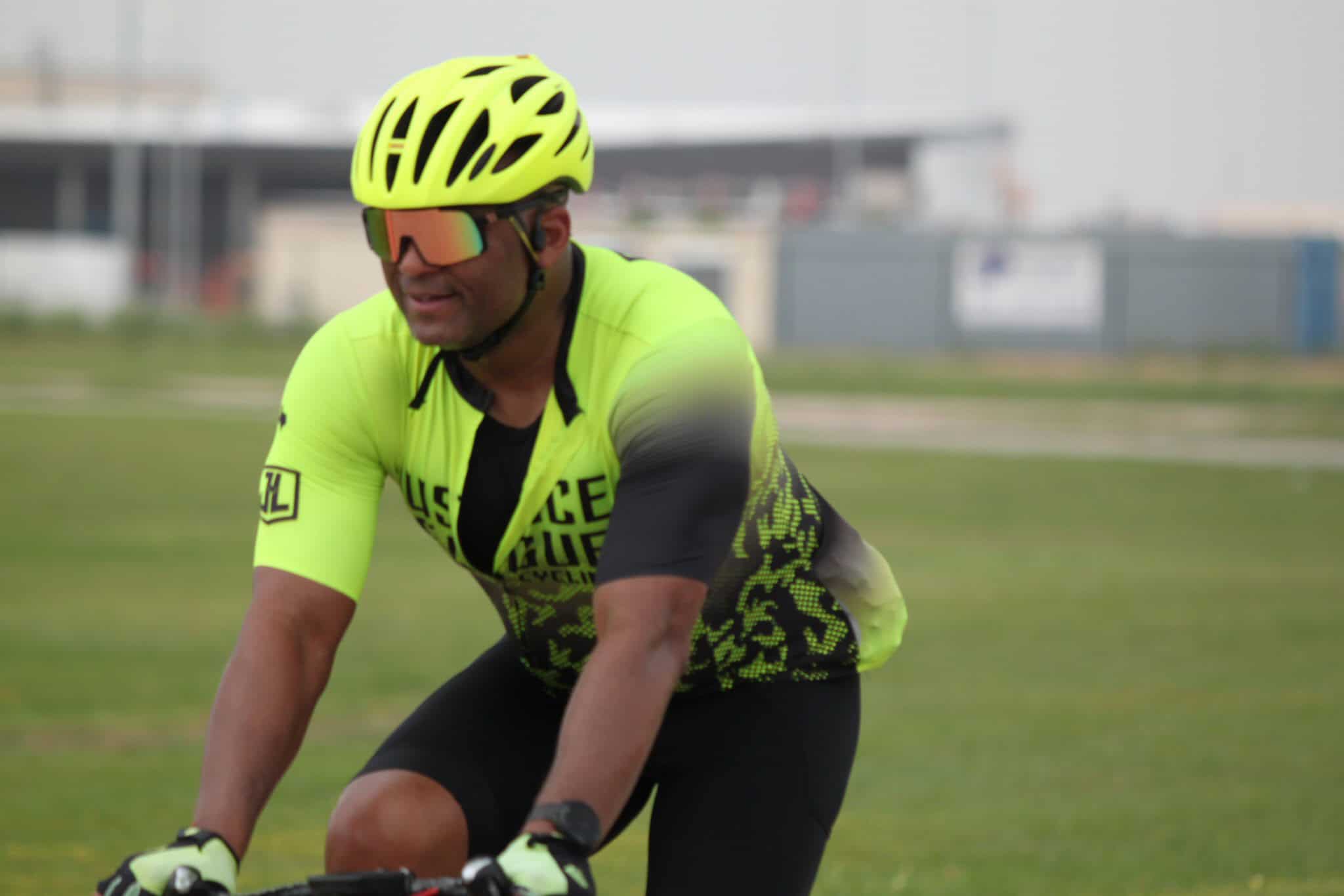 Bright yellow cyclist helmet and jersey for Bluebonnet Express bike events and cycling tours.