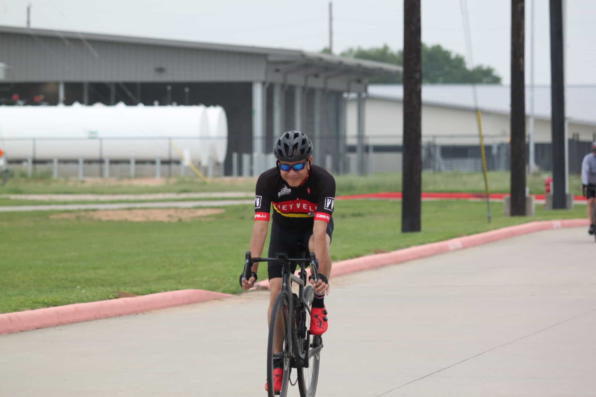 Cyclist riding a bike outdoors during daytime for Bluebonnet Express event.