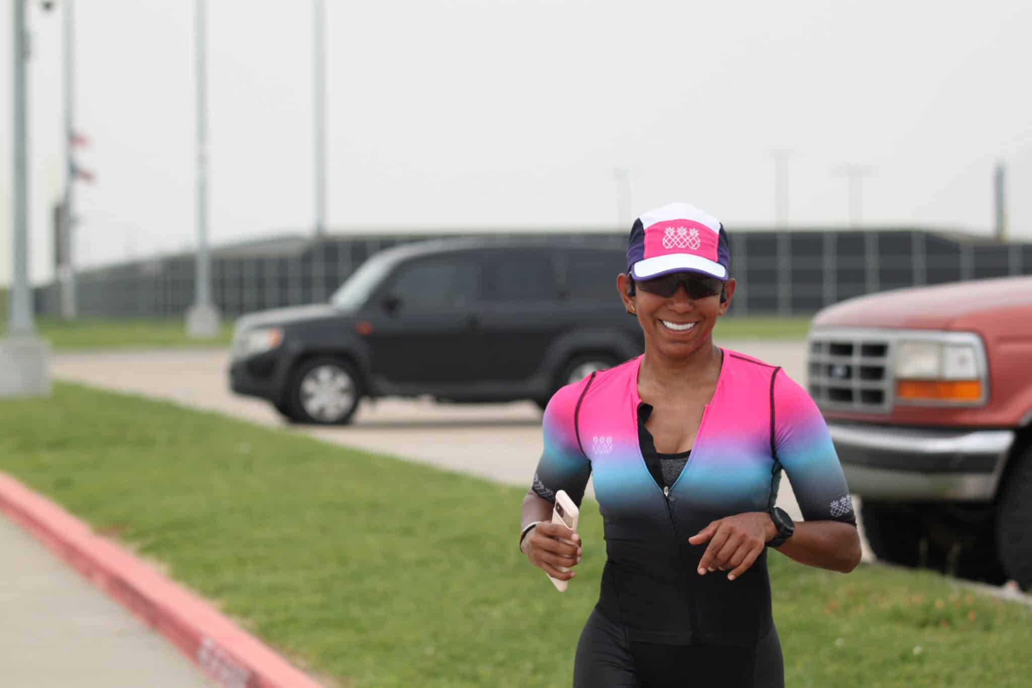 Vibrant female cyclist smiling during Bluebonnet Express race, showcasing cycling event and athletic performance.