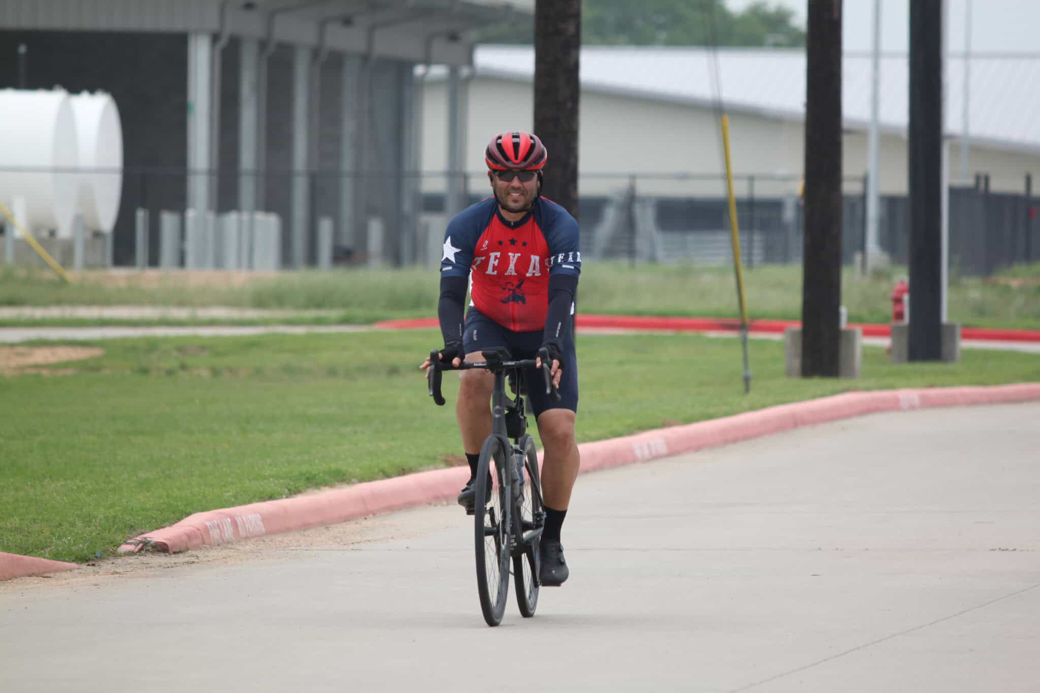 Smooth riding on Bluebonnet Express cycling route, Texas-themed cyclist enjoying an outdoor bike ride.