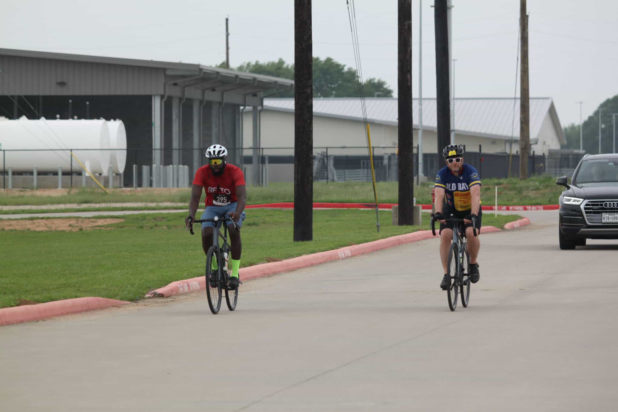 Cyclists riding on a paved road representing Bluebonnet Express cycling event.
