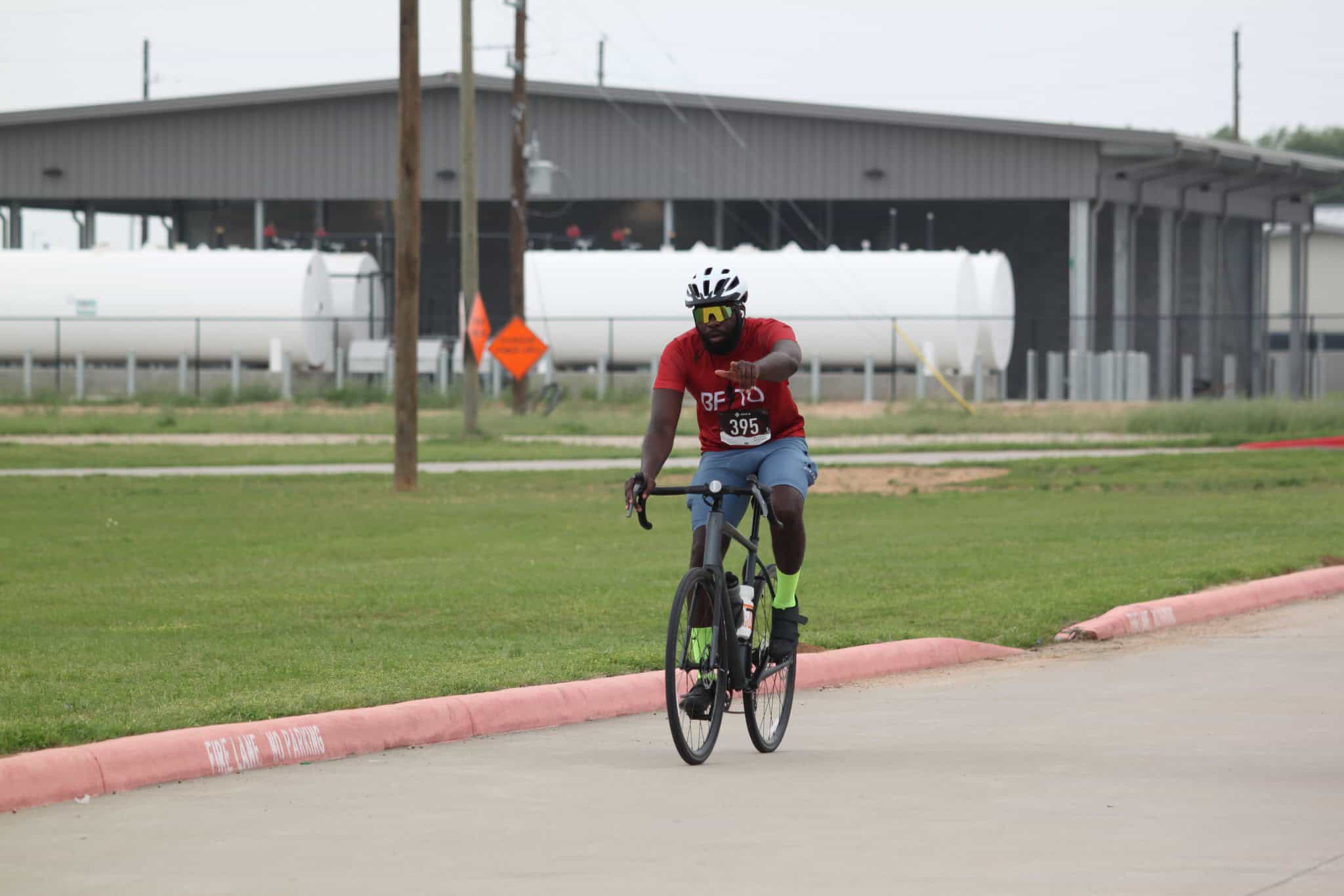 Bike rider on a paved road during a cycling event at Bluebonnet Express.