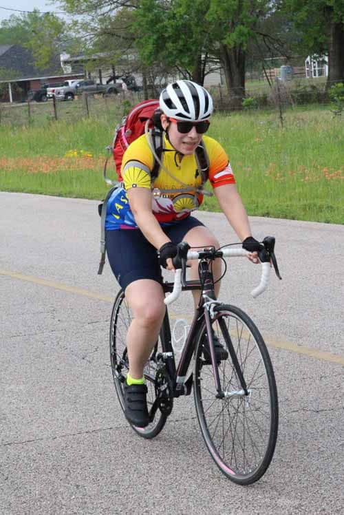 Bike rider on the Bluebonnet Express route enjoying outdoor cycling activity.