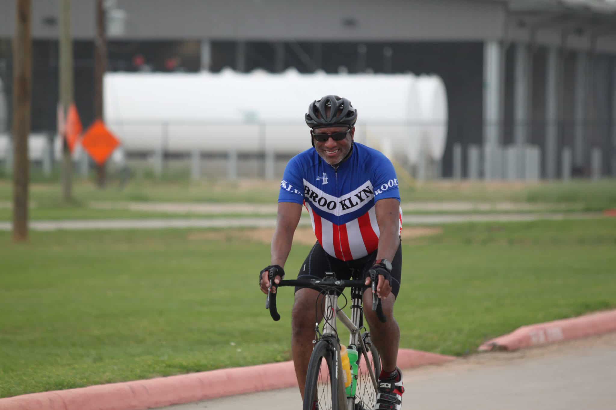 Enjoying cycling on the bike trail with Bluebonnet Express cycling jersey at the park.
