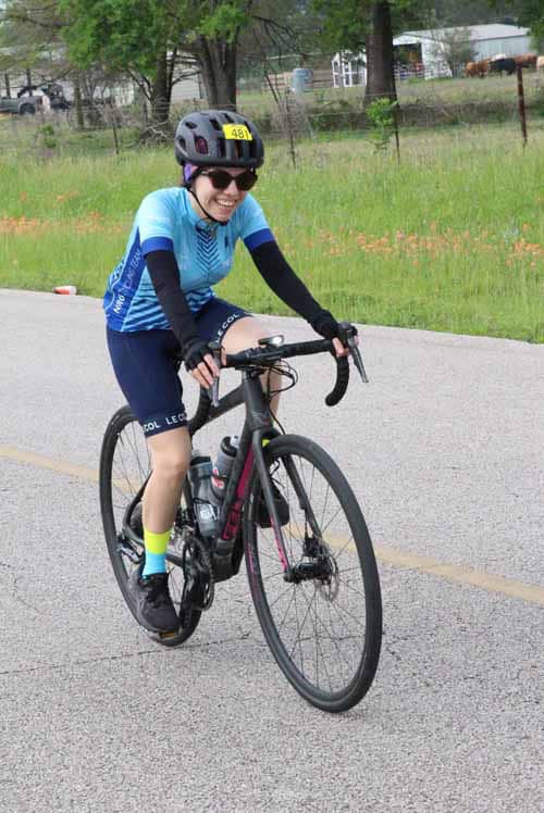 Bright cyclist riding a bike during Bluebonnet Express event, showcasing outdoor biking adventure.