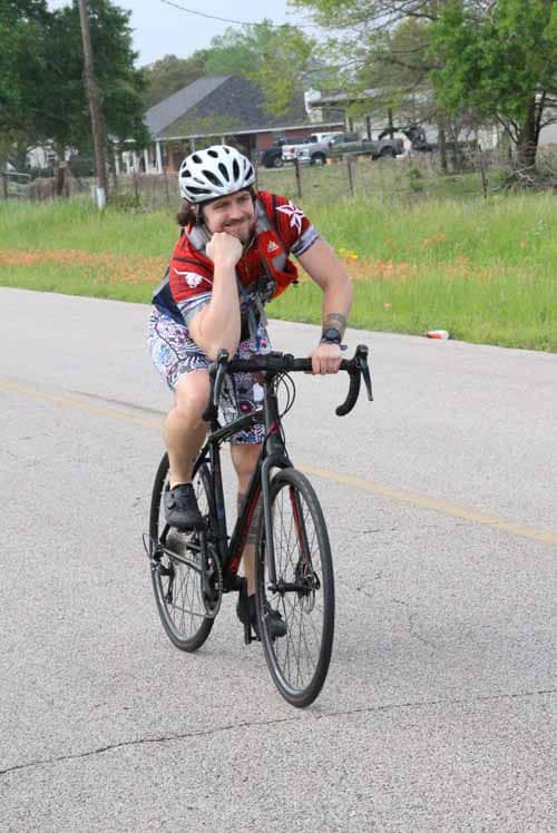 Enjoying a leisurely bike ride on the scenic Bluebonnet Express route with a cheerful cyclist in Texas.