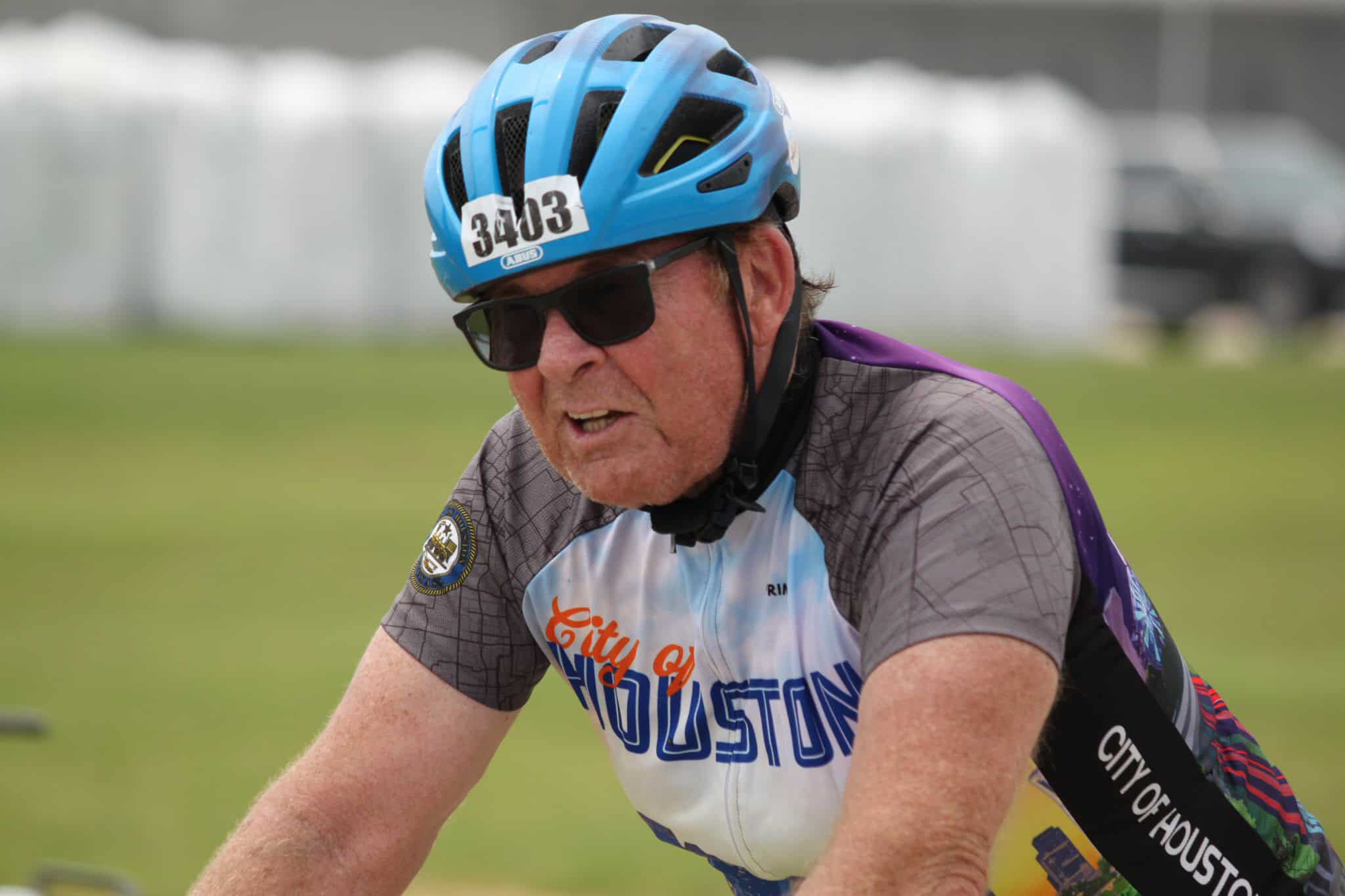 Sweater, helmet, sunglasses, cycling race, senior athlete, Houston, biking event, outdoor sports, competitive cycling, amateur cyclist.