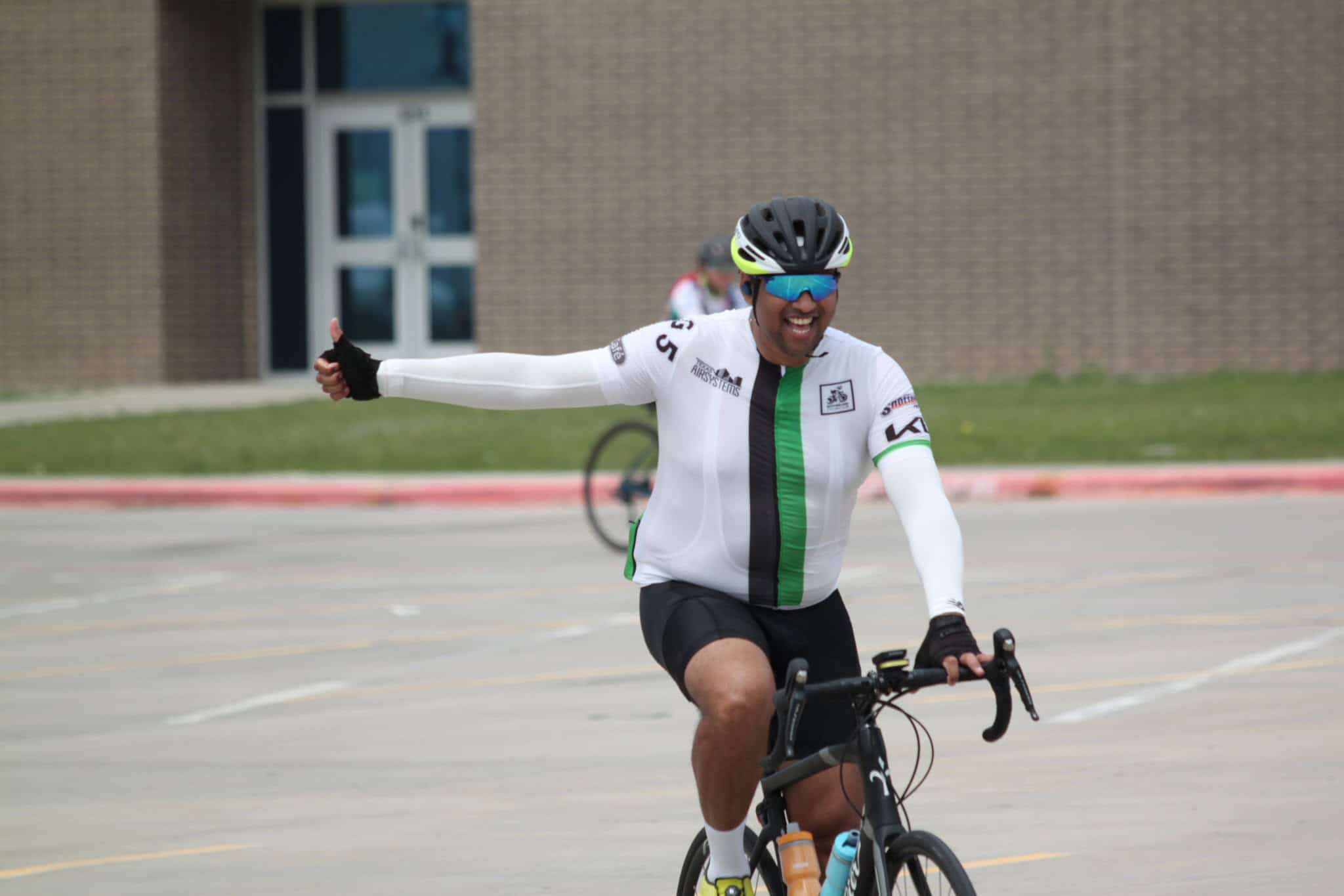 Energetic cyclist enjoying Bluebonnet Express bike ride event.