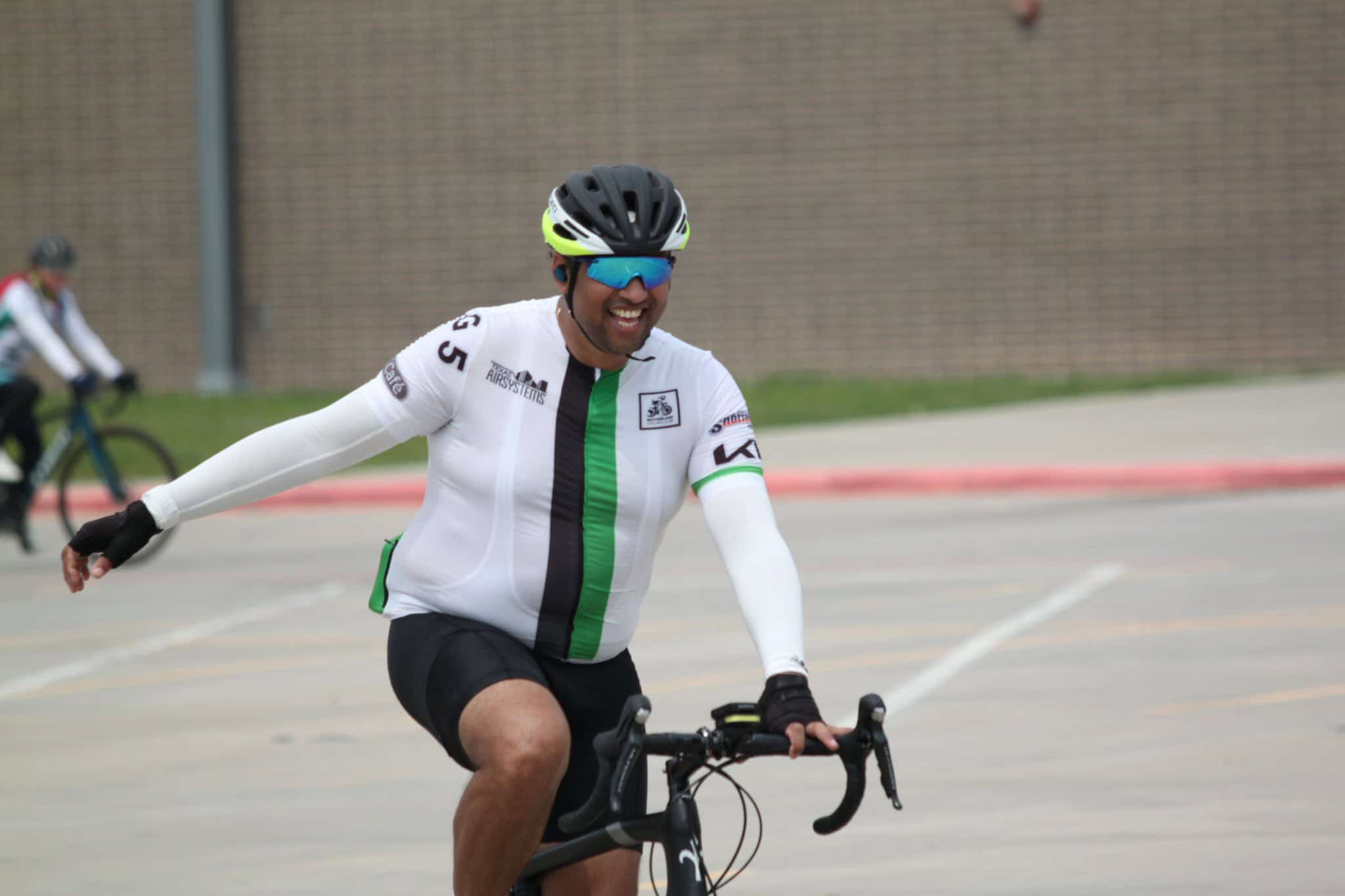 Vibrant cyclist smiling during Bluebonnet Express bike ride event in Texas.