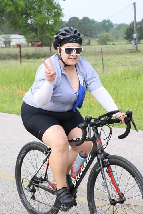 Comfortable female cyclist enjoying a ride on Bluebonnet Express bike trail.