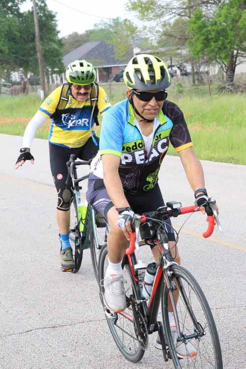Vibrant cyclists riding during Bluebonnet Express, showcasing outdoor adventure and cycling event in Texas.