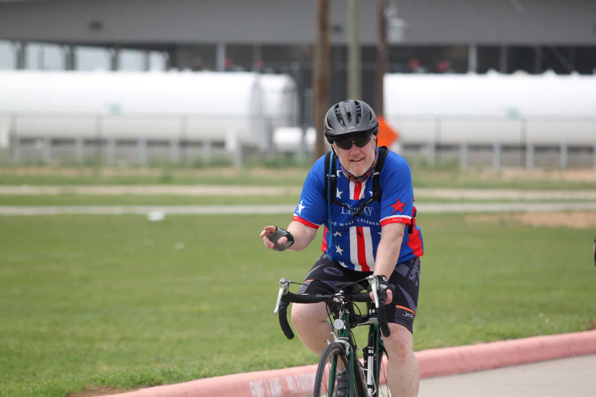 Colorado cycling event, man riding bike at Bluebonnet Express, cycling race, outdoor sports, fitness, cycling competition.