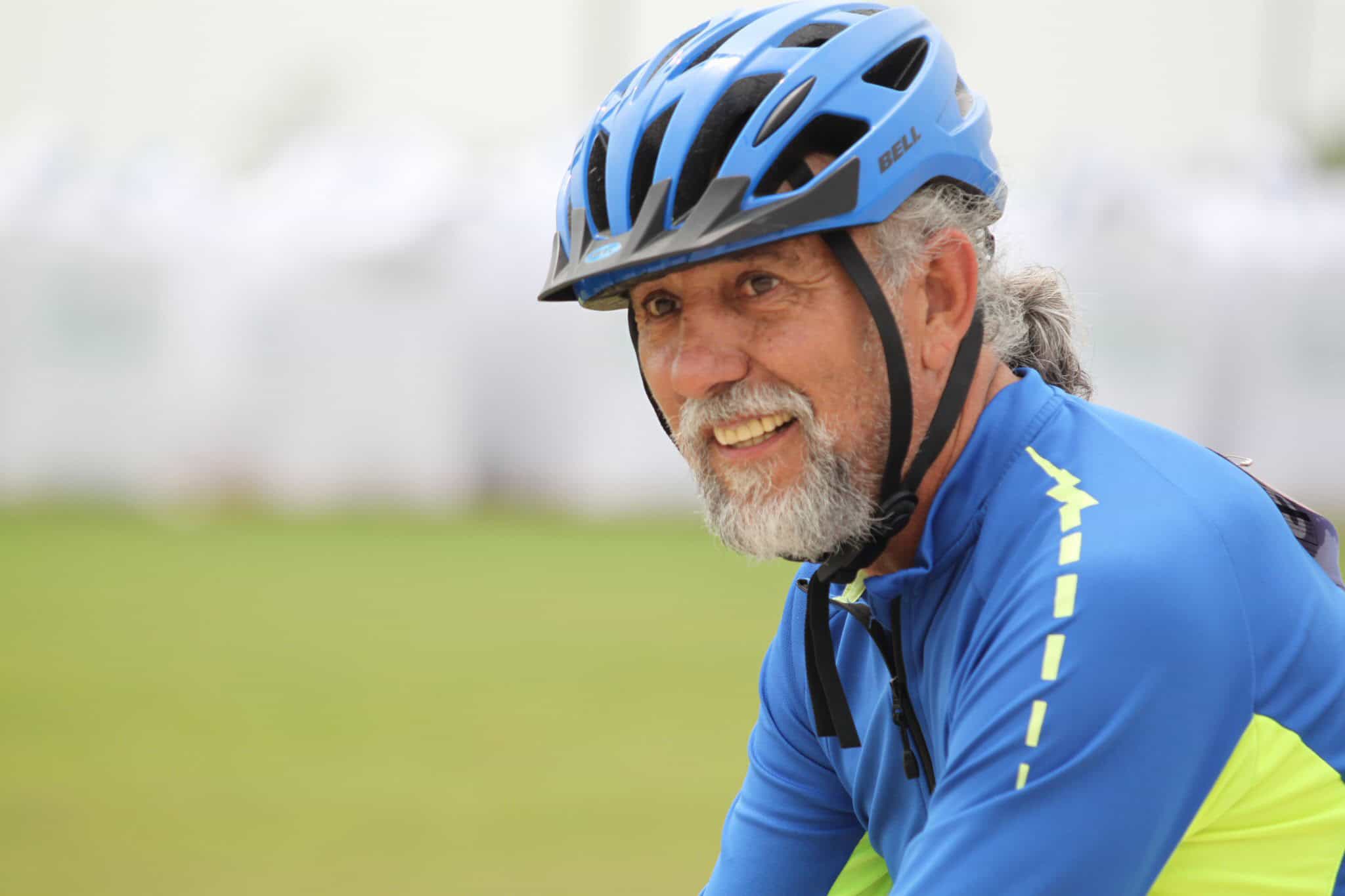 Comfortable blue mountain biking helmet for adults with adjustable straps.