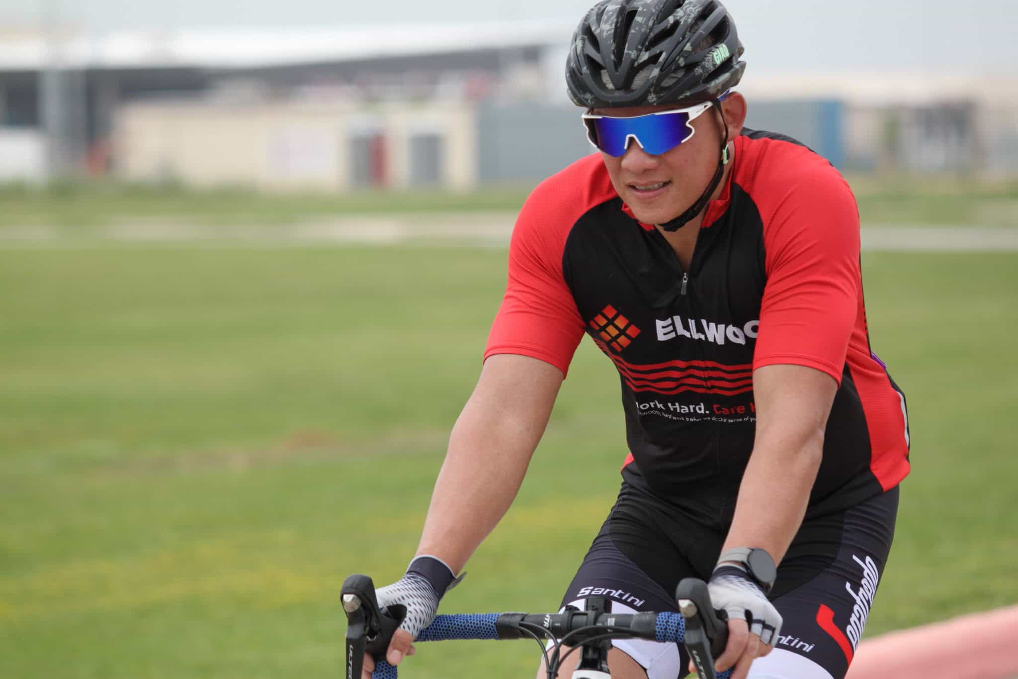 Cyclist wearing Ellwood sports gear riding a mountain bike outdoors for Bluebonnet Express.