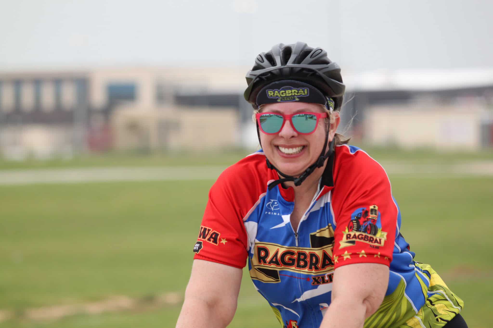 Fast-paced cyclist enjoying outdoor ride on Bluebonnet Express trail.