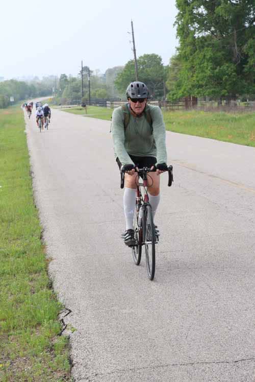 Riders on the Bluebonnet Express bike trail enjoying a scenic outdoor cycling experience.