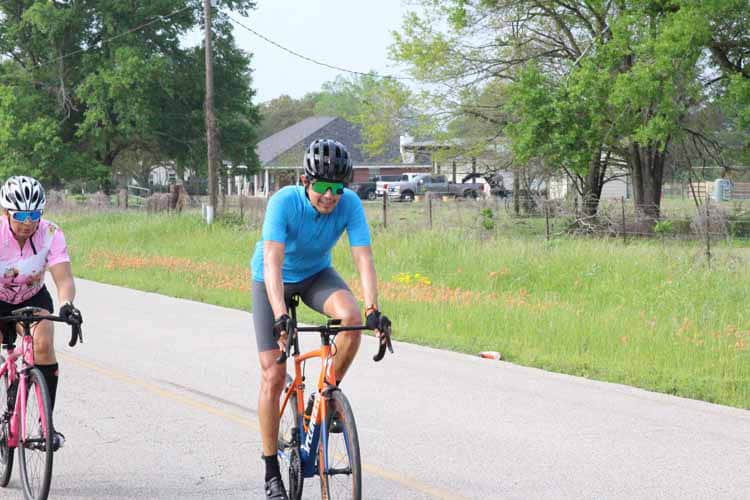Smooth road cycling with Bluebonnet Express bike service in scenic Texas countryside.