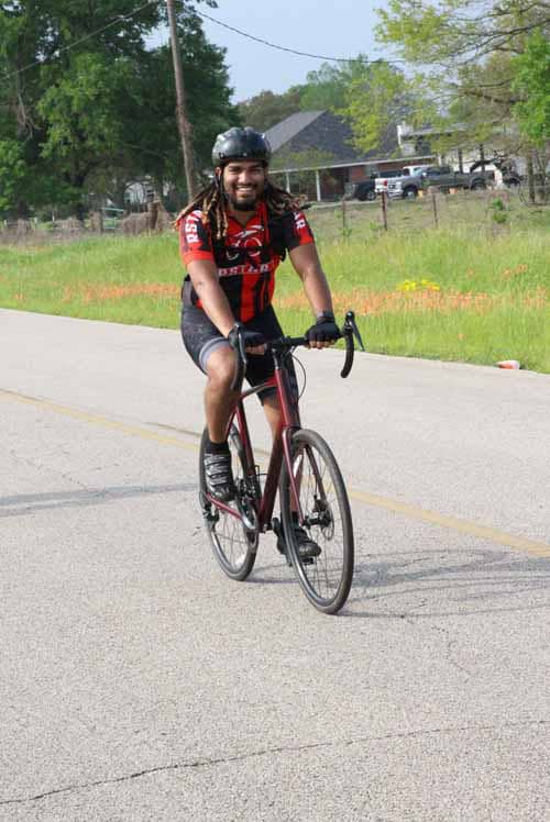 Rider on a bike during Bluebonnet Express event, outdoor cycling, Texas scenic route, healthy lifestyle.