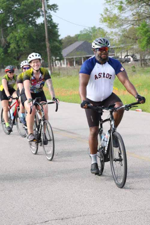 Family cycling outdoor on a sunny day, promoting safe bicycle rides and outdoor recreation.