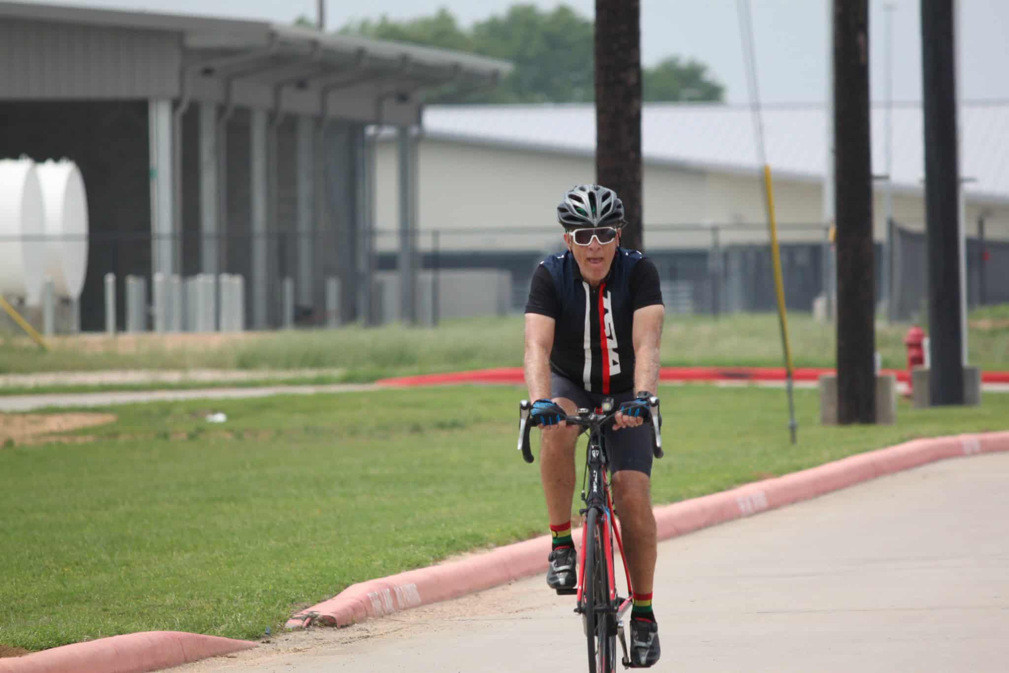 Bike rider on the Bluebonnet Express cycling route during daytime.