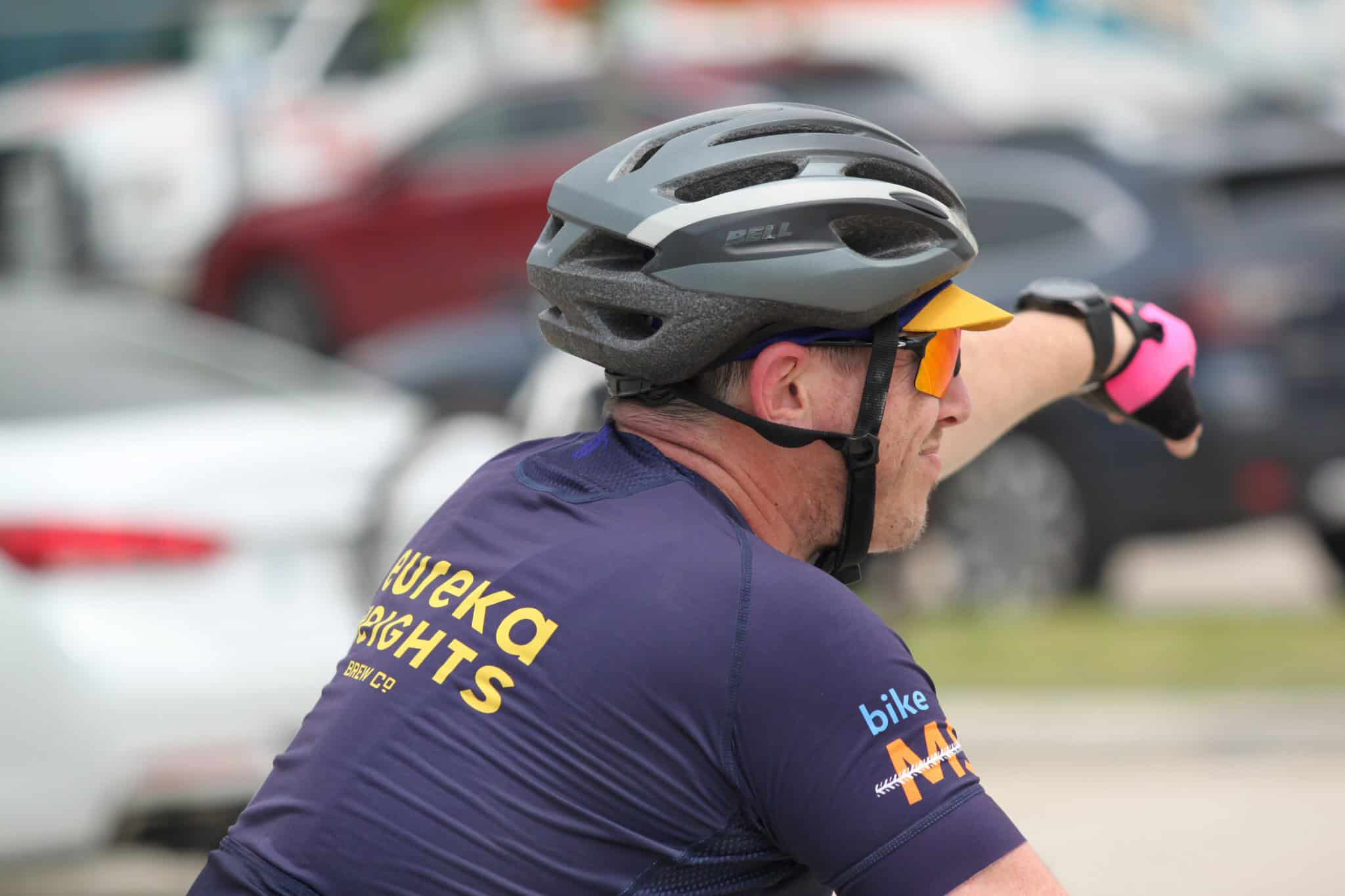 Helmet and cycling gear on a cyclist during a bike event.