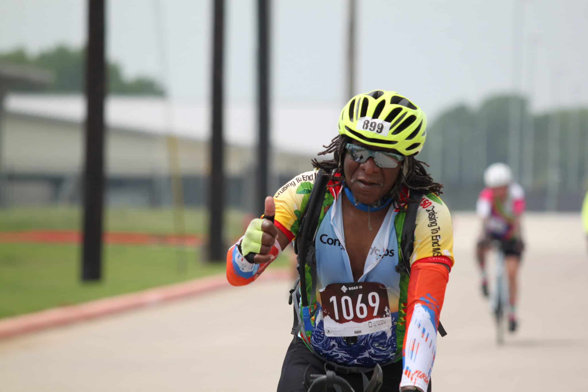 Active cyclist wearing helmet and sunglasses during Bluebonnet Express race for outdoor biking event.