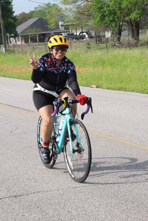 Smiling cyclist wearing helmet, ideal for Bluebonnet Express bike tours and Texas cycling events.