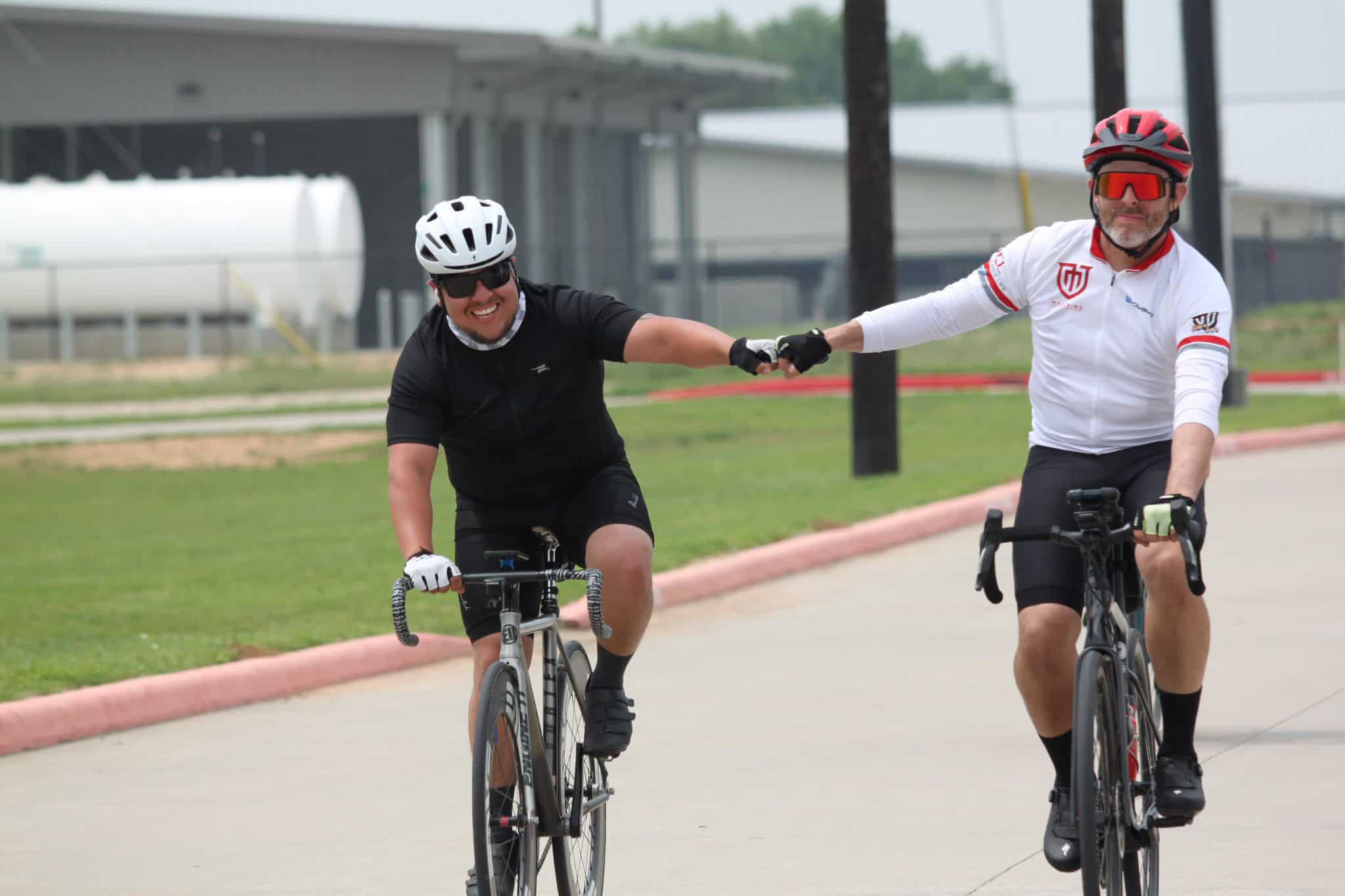 Enjoying a bike ride together on a sunny day with the Bluebonnet Express cycling service.