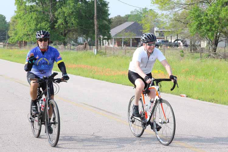 Enjoying Bluebonnet Express biking tour on scenic rural roads in Texas.